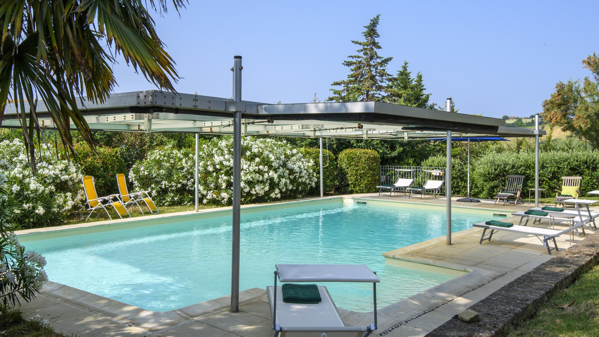 Swimming pool with equipped relaxation area – Ca Lucciola