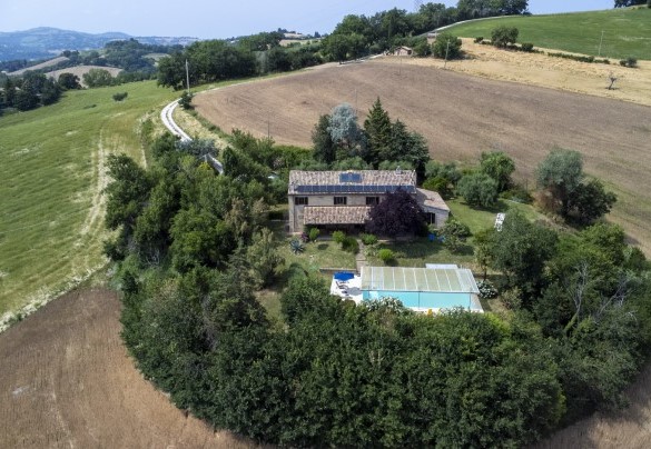 Aerial view of the villa surrounded by hills – Ca Lucciola