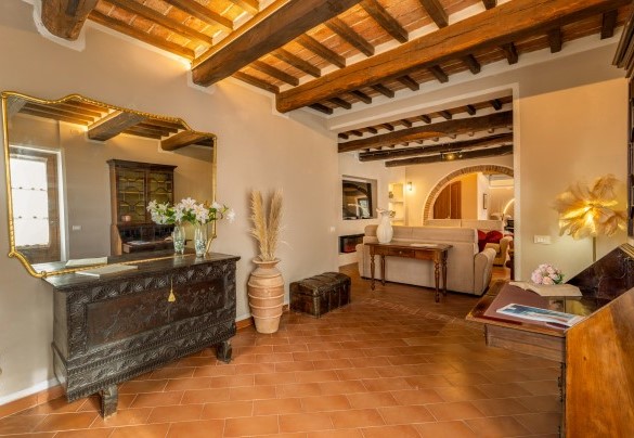 The ground-floor entrance hall leads into the living room - La Burraia