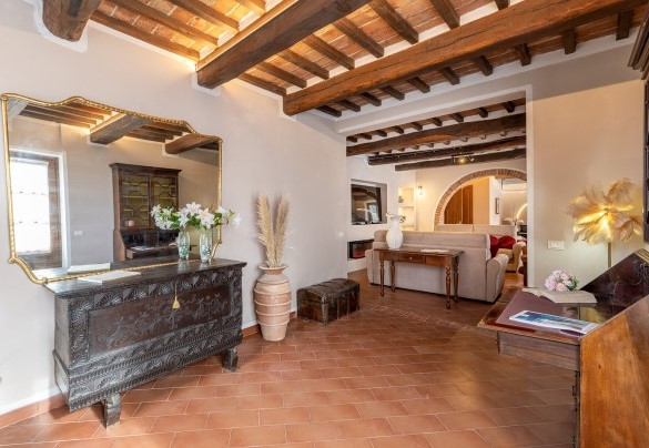 The ground-floor entrance hall leads into the living room - La Burraia