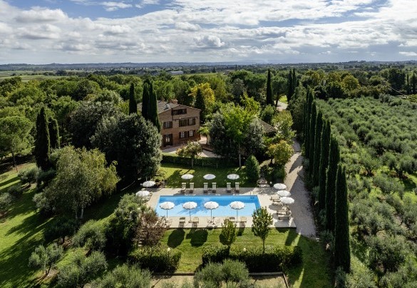 Aerial view of the property set in a lush park - La Burraia